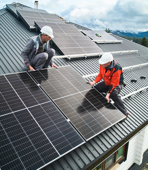 men-workers-installing-solar-panels-on-roof-of-hou-2023-11-27-04-51-54-utc